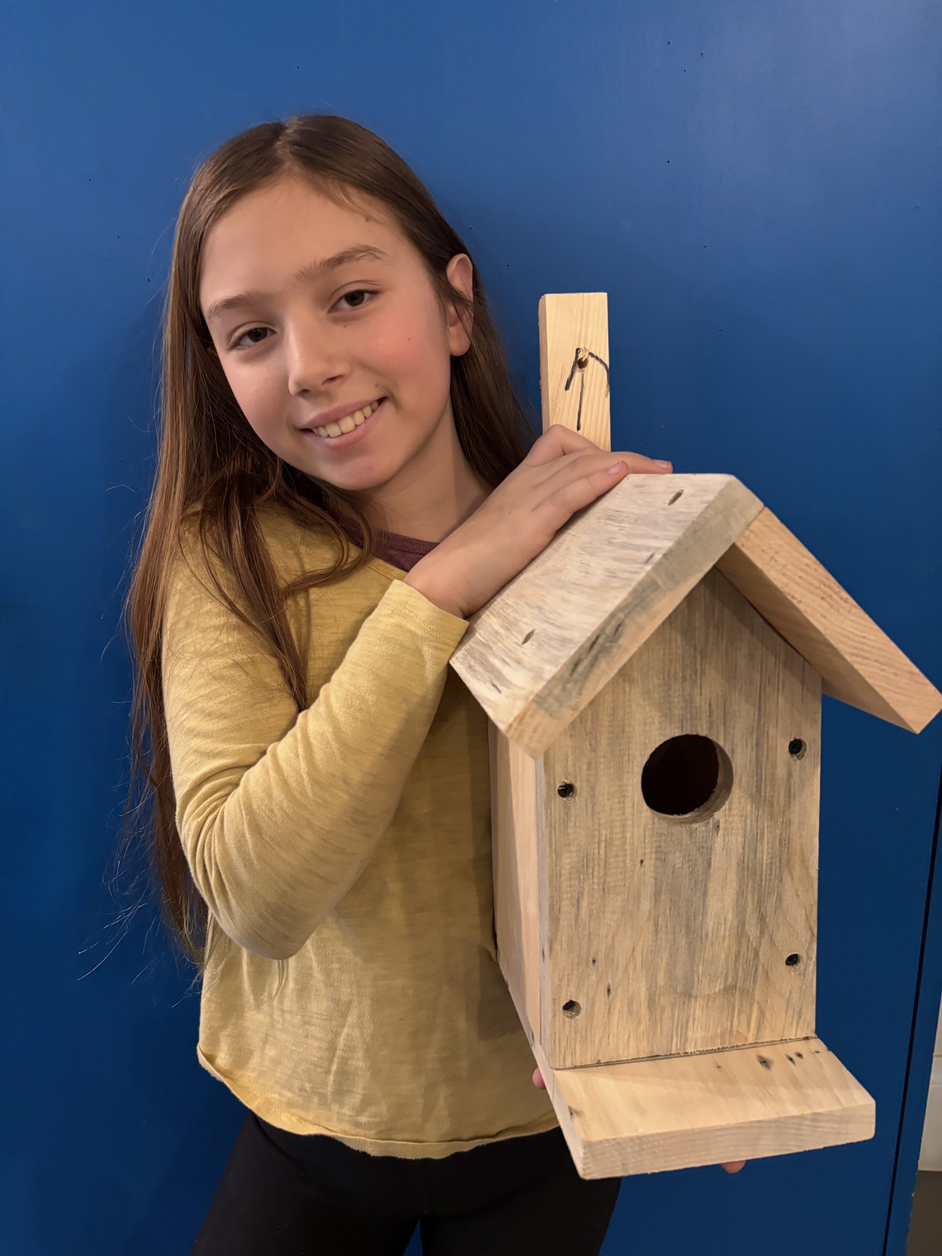 A student dressed in a bee keeper costume.